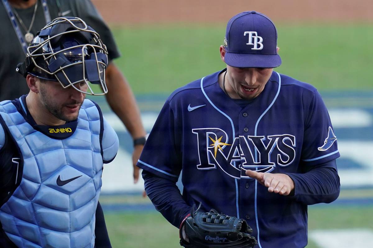 Tampa Bay Rays pitcher Blake Snell talks to catcher Mike Zunino during the  second inning in Gam …