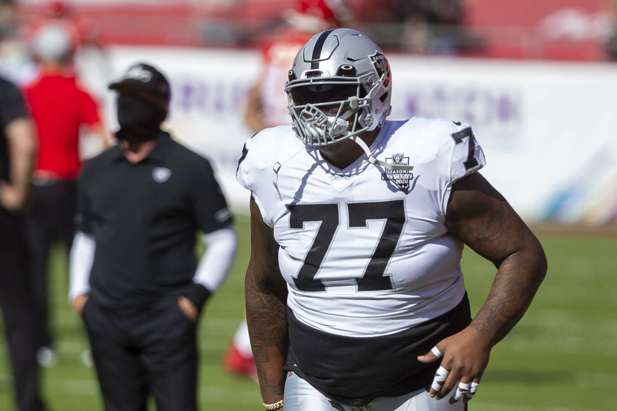 Las Vegas Raiders offensive tackle Trent Brown (77) warms up on the field before an NFL footbal ...