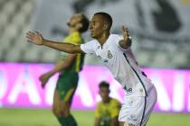 Lucas Braga of Brazil's Santos celebrates scoring his side's second goal against Argentina's De ...
