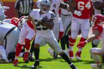Las Vegas Raiders running back Devontae Booker (23) runs with the football against the Kansas C ...