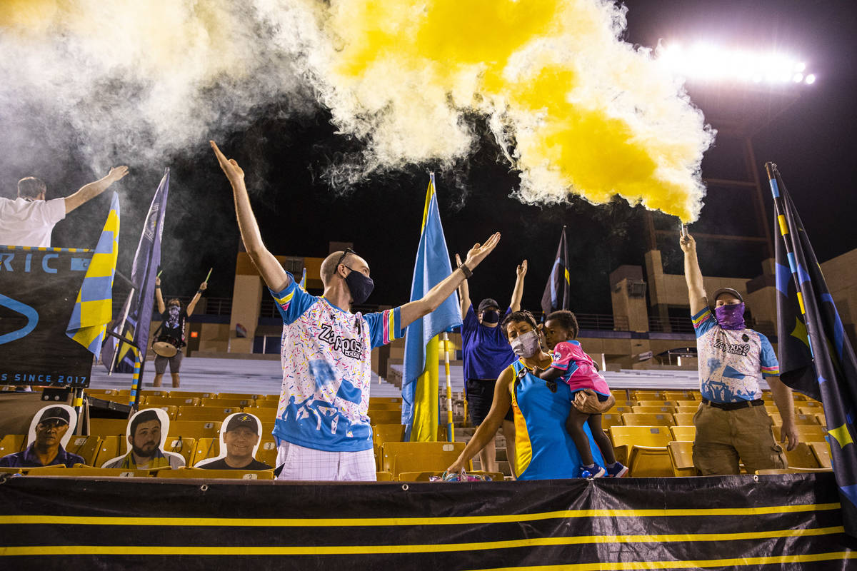 Las Vegas Lights FC fans cheer at the start of a USL Championship soccer game against Orange Co ...