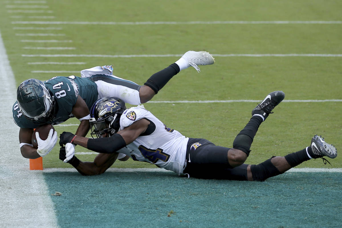 Philadelphia Eagles wide receiver Greg Ward (84) dives for a two-point conversion against Balti ...