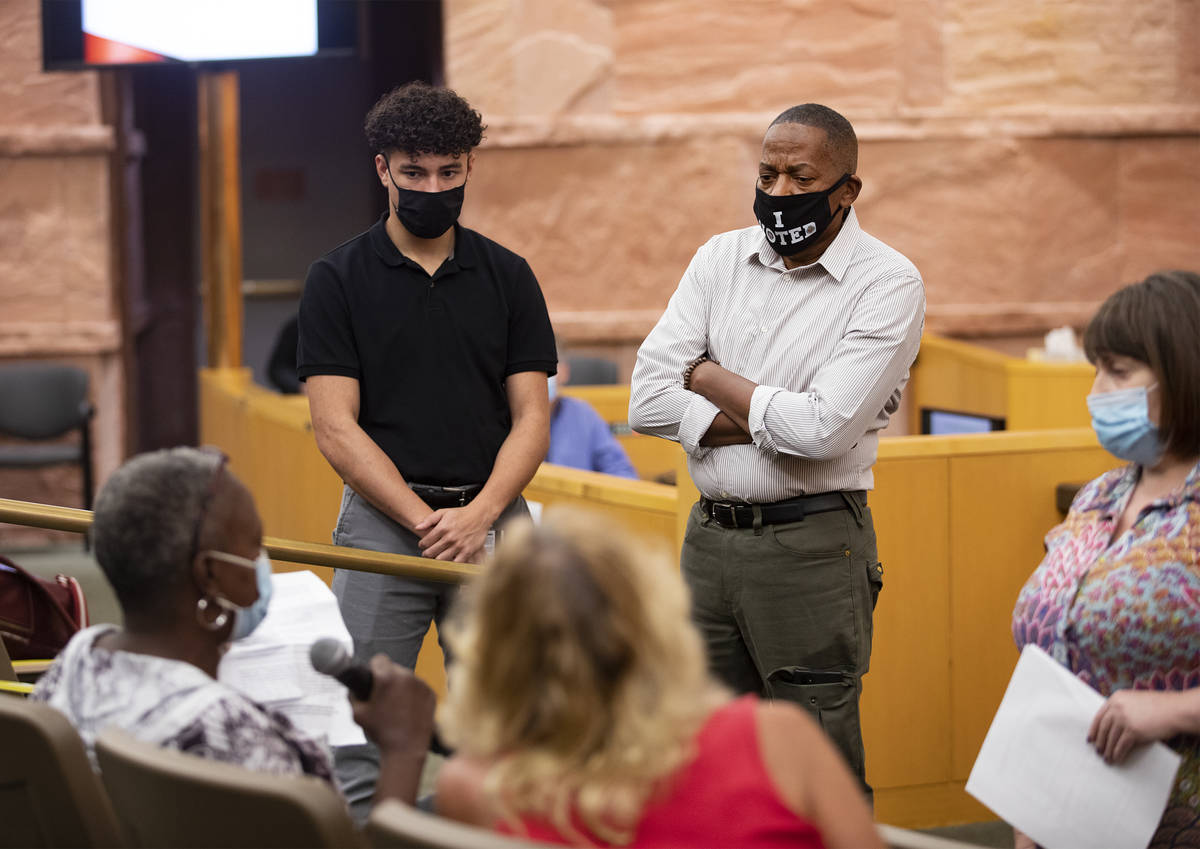 Clark County Commissioner Lawrence Weekly listens to tenant Rhonda Manuel as she discusses her ...