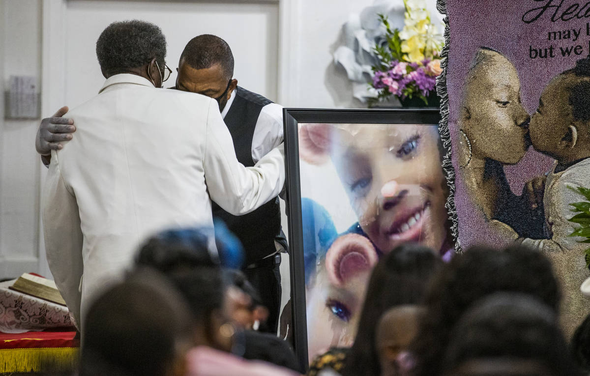 A family member has a private moment during the funeral service for Sayah Deal at the Tried Sto ...