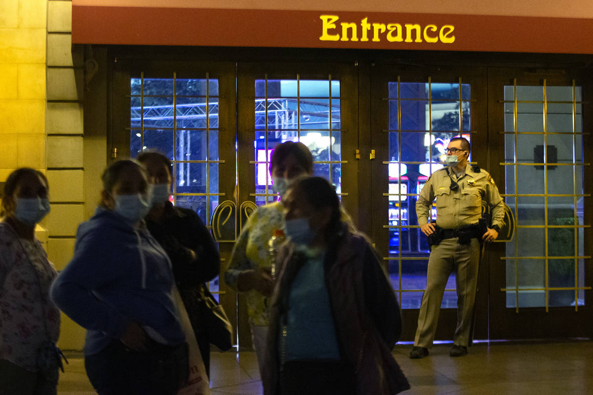 Metropolitan police guard the doors outside Paris Las Vegas following a power outage as evacuat ...