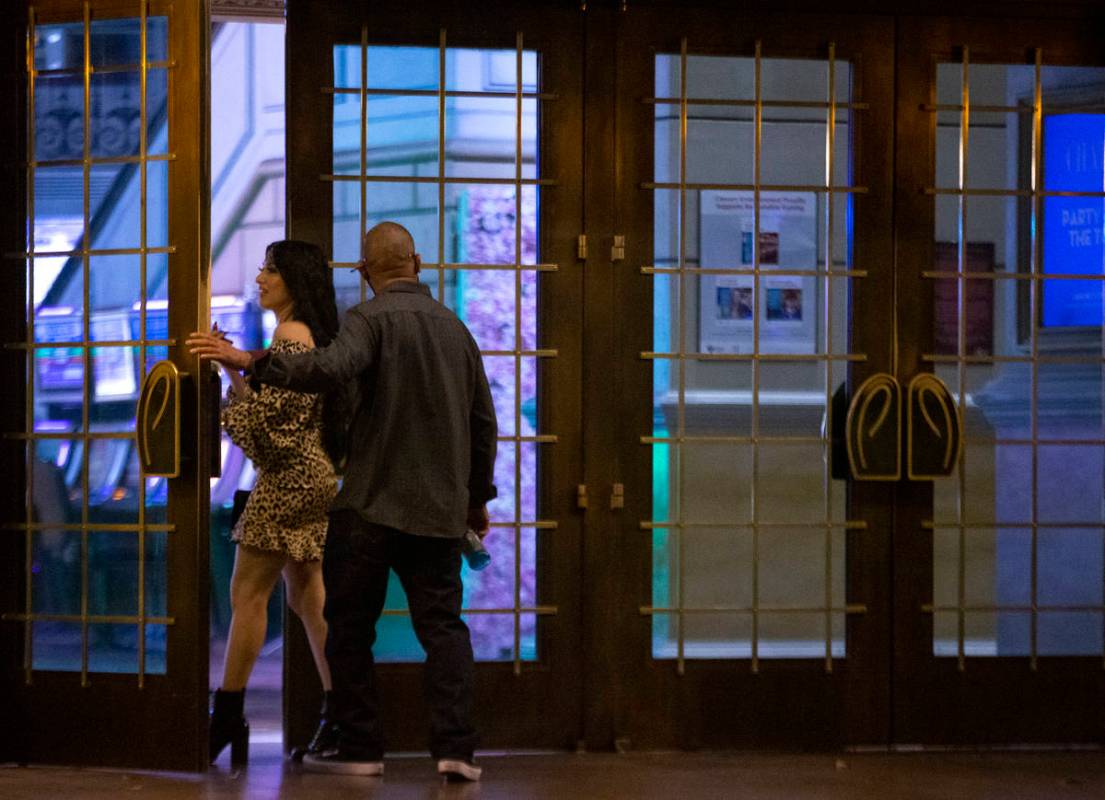 People enter Paris Las Vegas following a building evacuation due to a power outage on Thursday, ...