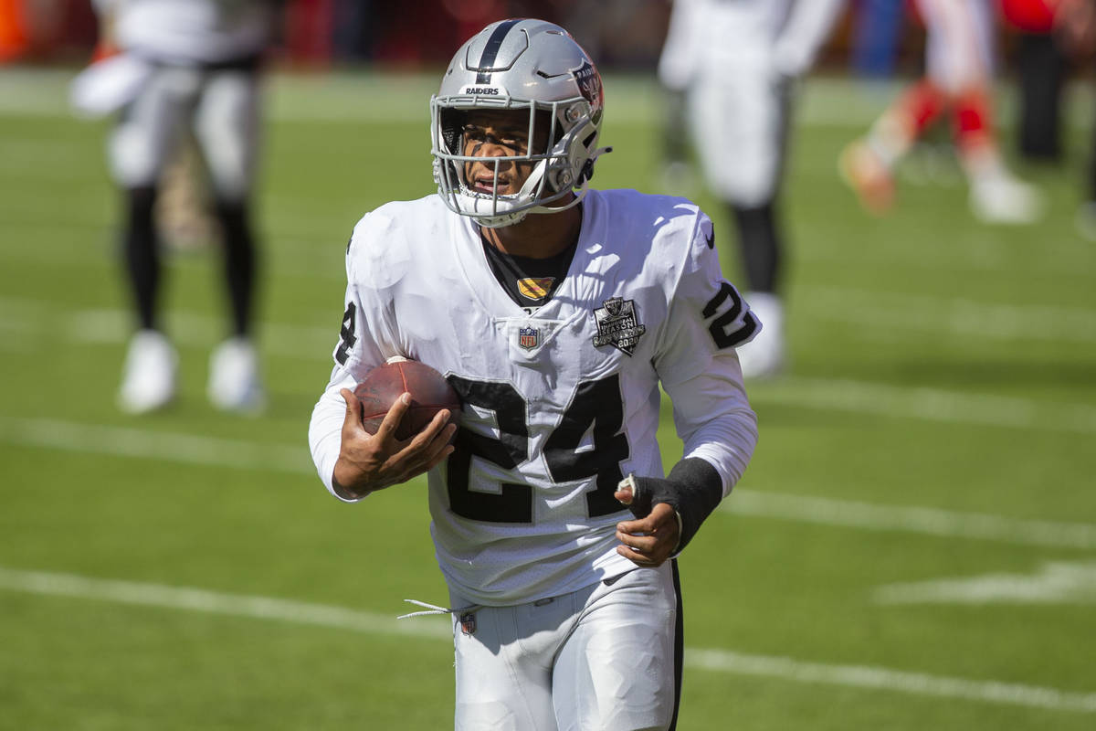 Las Vegas Raiders strong safety Johnathan Abram (24) runs with the football before an NFL footb ...