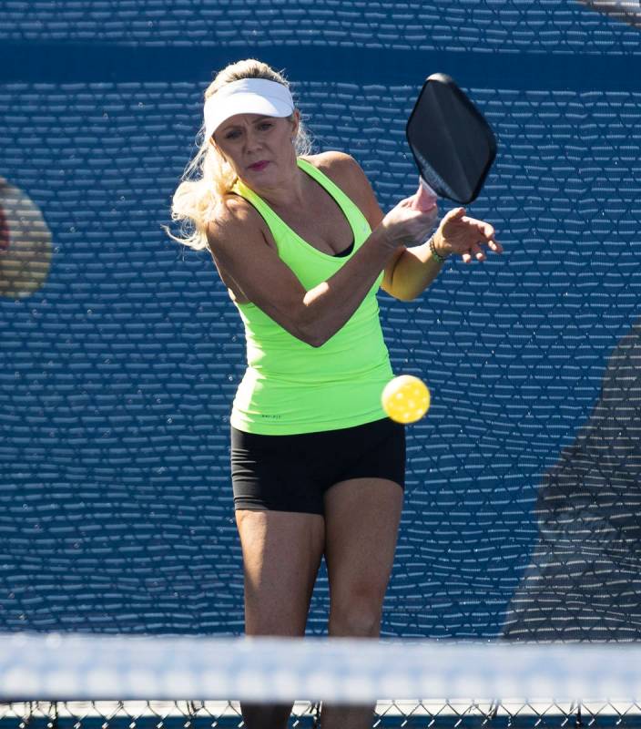 Christee Chargot, of Astro, Fla., returns the ball to Jean Halaham of Washingtonville, N.Y., du ...