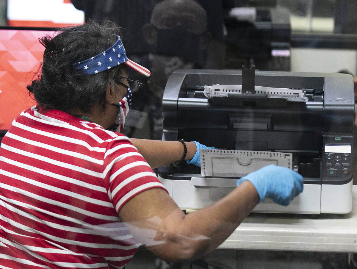 A Clark County election worker scans ballots at the Election Department warehouse, on Tuesday, ...