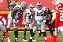 Las Vegas Raiders offensive tackle Trent Brown (77) communicates with offensive guard Gabe Jack ...