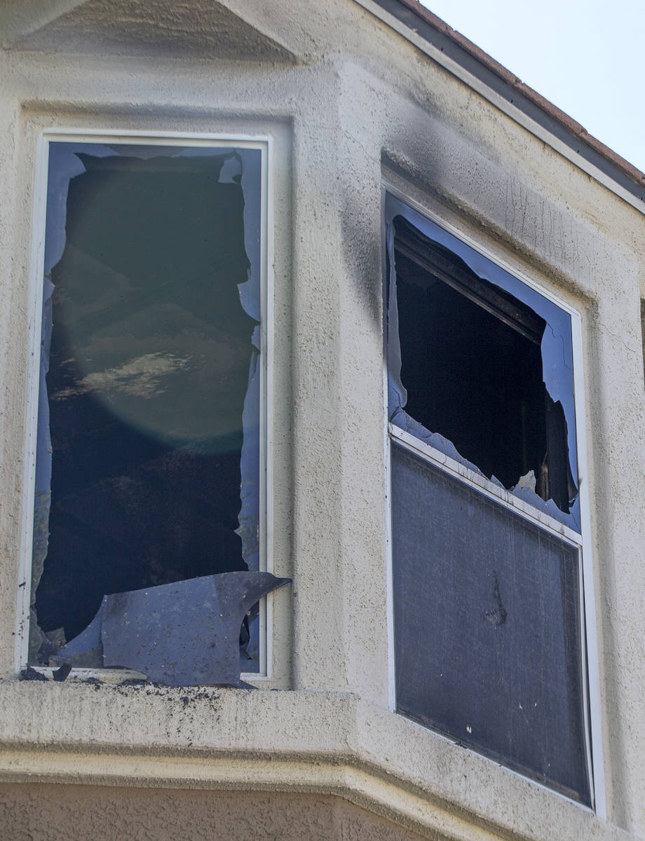 Burned out windows at an apartment in a complex at 10115 Jeffreys Street, near South Eastern Av ...