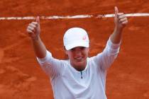 Poland's Iga Swiatek celebrates winning the final match of the French Open tennis tournament ag ...