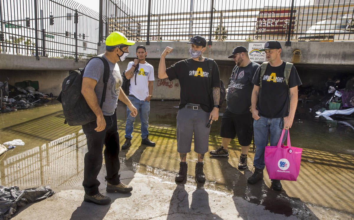 Crossroads CEO Dave Marlon, left, greets volunteers with Shine A Light as he conducts a monthly ...