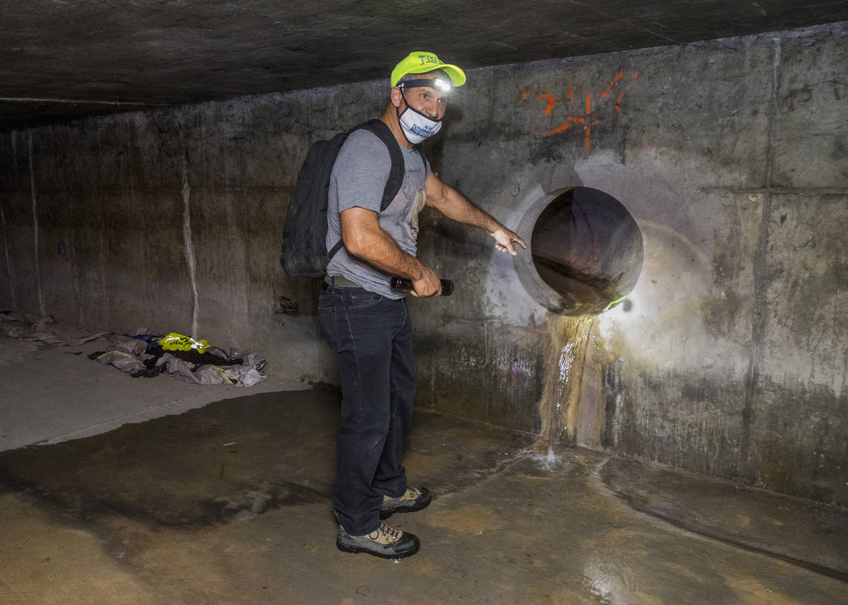 Crossroads CEO Dave Marlon looks at one of the water sources in a flood control tunnel near the ...