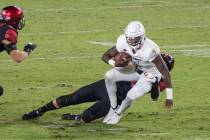 UNLV’s Justin Rogers is sacked by San Diego State’s Connor Mitchell during Saturday's Mount ...