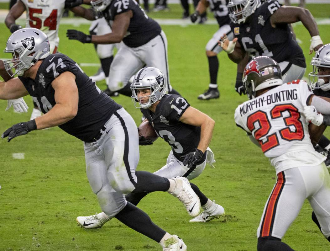 Las Vegas Raiders wide receiver Hunter Renfrow (13) makes a reception past Tampa Bay Buccaneers ...