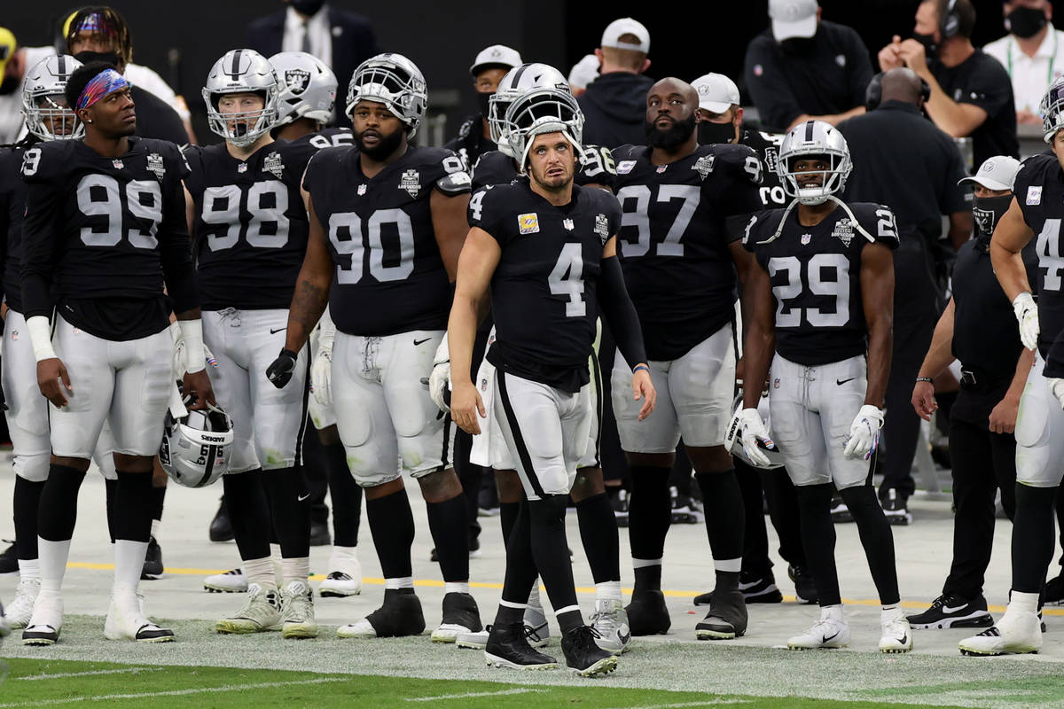 Las Vegas Raiders quarterback Derek Carr (4) looks at the scoreboard in the third quarter durin ...