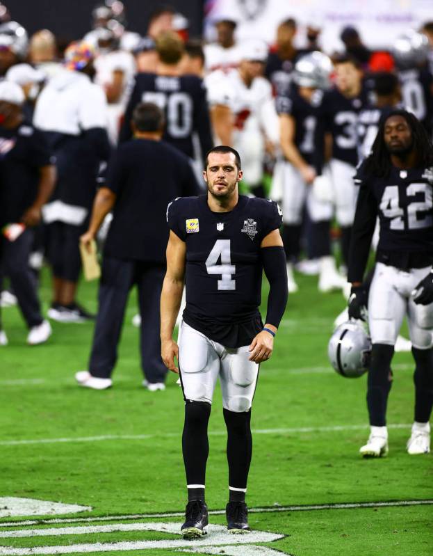 Las Vegas Raiders quarterback Derek Carr (4) walks off the field after an NFL football game on ...