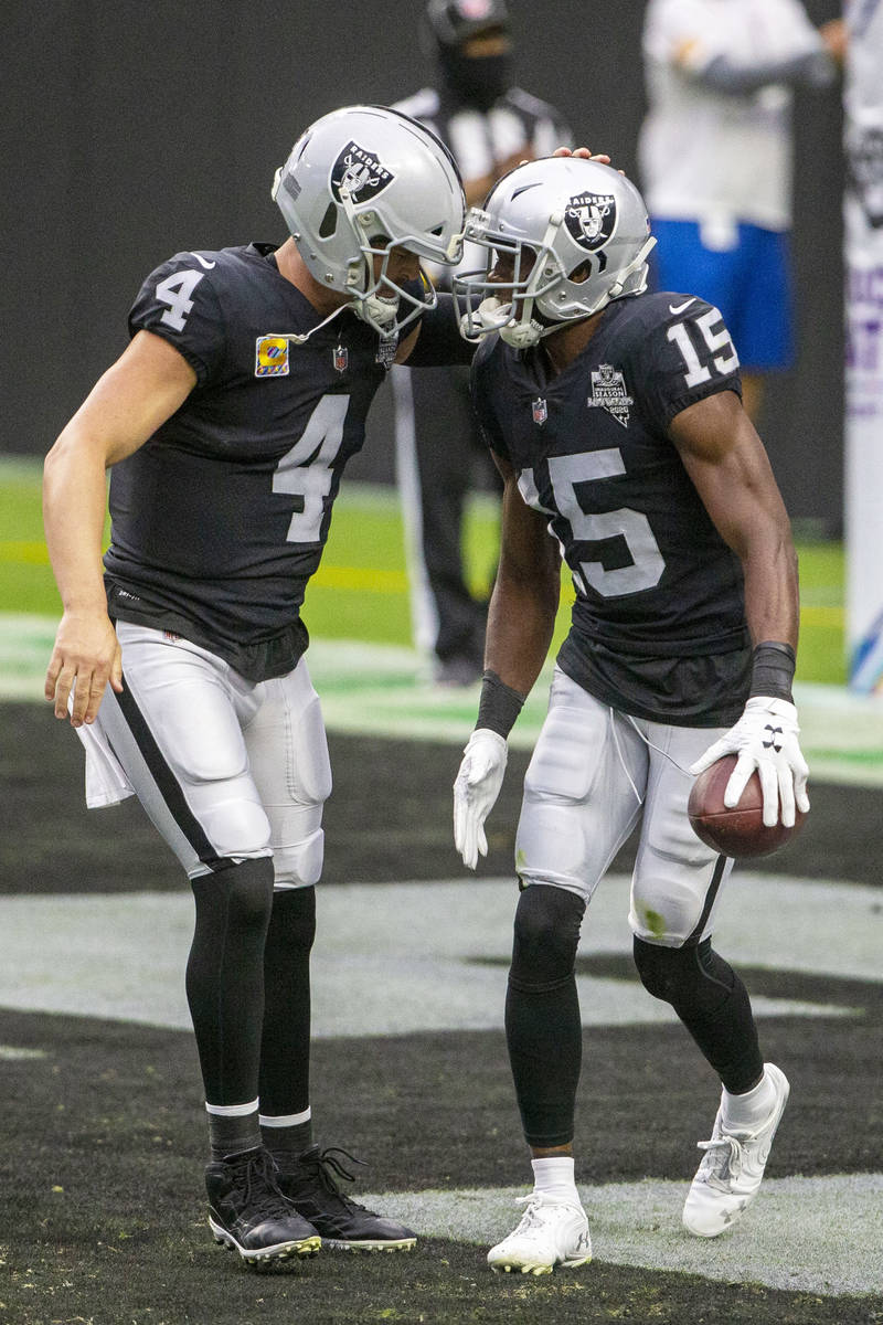 Las Vegas Raiders wide receiver Nelson Agholor (15) celebrates his touchdown with quarterback D ...