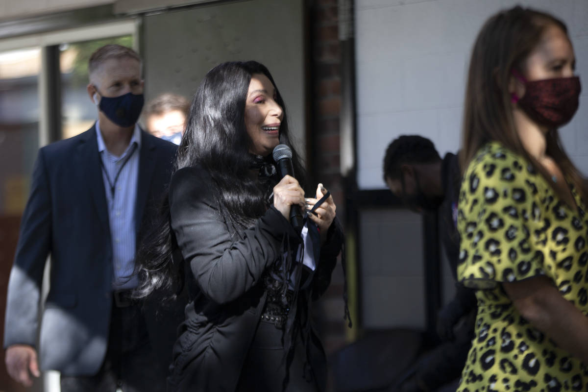 Cher walks on stage to campaign for Joe Biden and Kamala Harris at an event geared toward the L ...