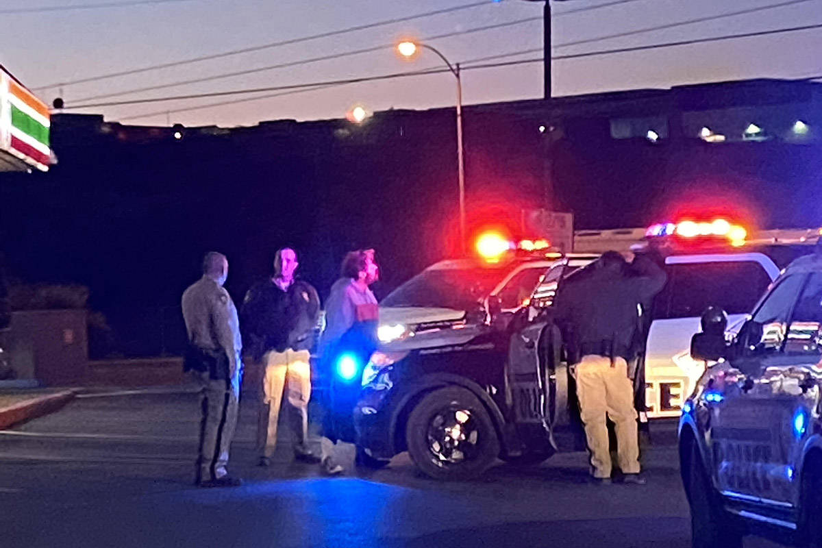 Las Vegas police detain a man near Mountain Vista Street and East Tropicana Avenue about 5:20 a ...