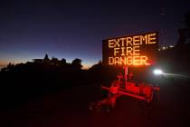 A roadside sign warns motorists of extreme fire danger on Grizzly Peak Boulevard, in Oakland, C ...