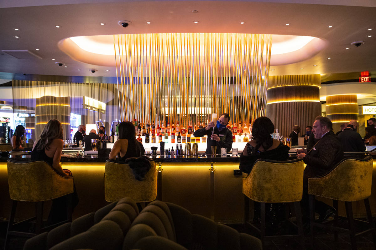 A bartender prepares drinks at Vegas Vickie's at Circa during the VIP black-tie grand opening e ...