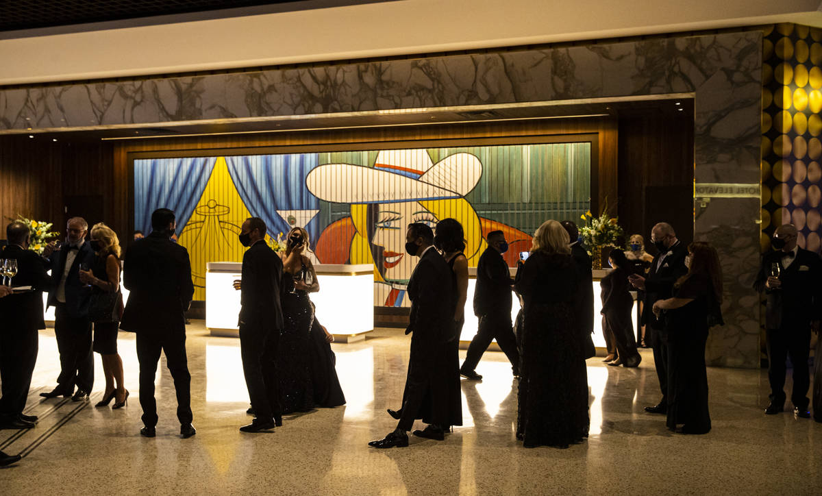 Invited guests line up to take a photo at the Circa lobby during the VIP black-tie grand openin ...