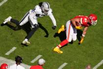 Kansas City Chiefs tight end Travis Kelce (87) runs from Las Vegas Raiders inside linebacker Co ...