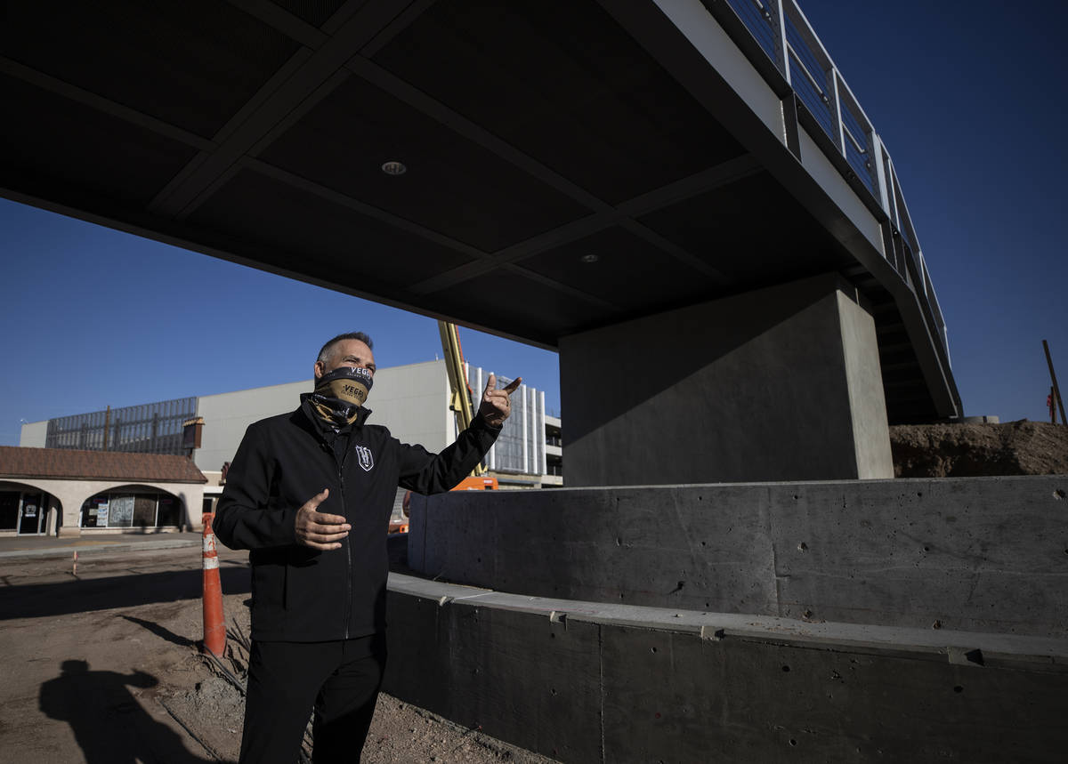 Darren Eliot, vice president of hockey programming and facility operations, points out features ...