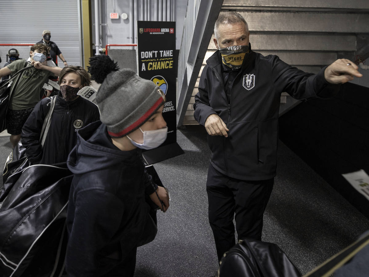 Darren Eliot, vice president of hockey programming and facility operations, directs junior play ...