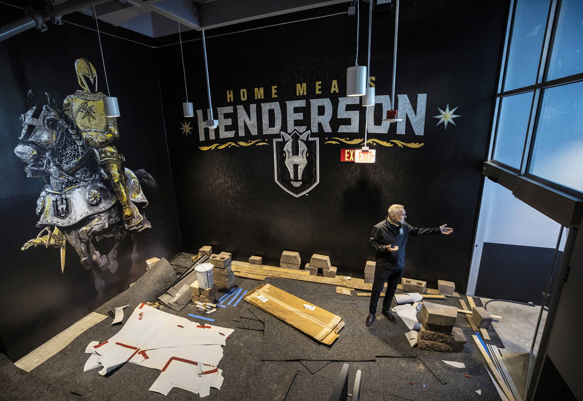 Darren Eliot, vice president of hockey programming and facility operations, points out features ...