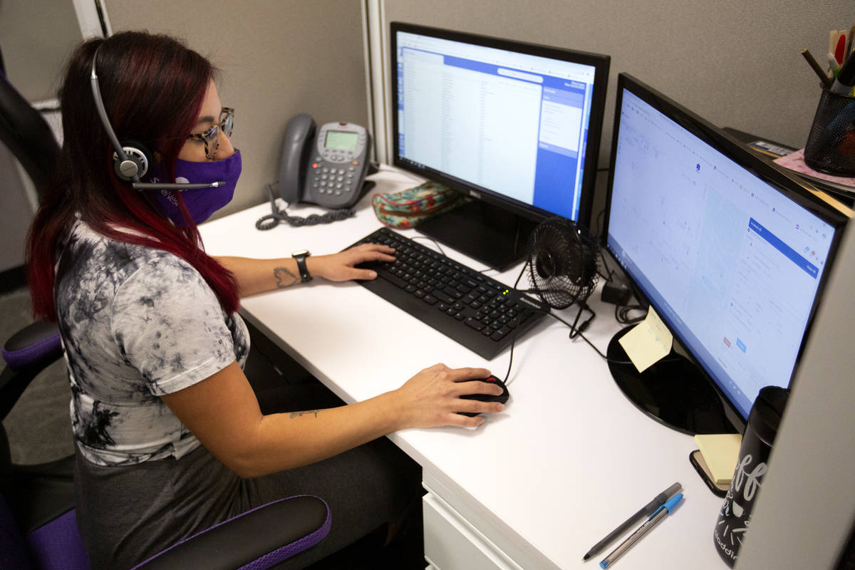 Alma Lopez, a crisis advocate at SafeNest, demonstrates their new dispatch technology on Monday ...