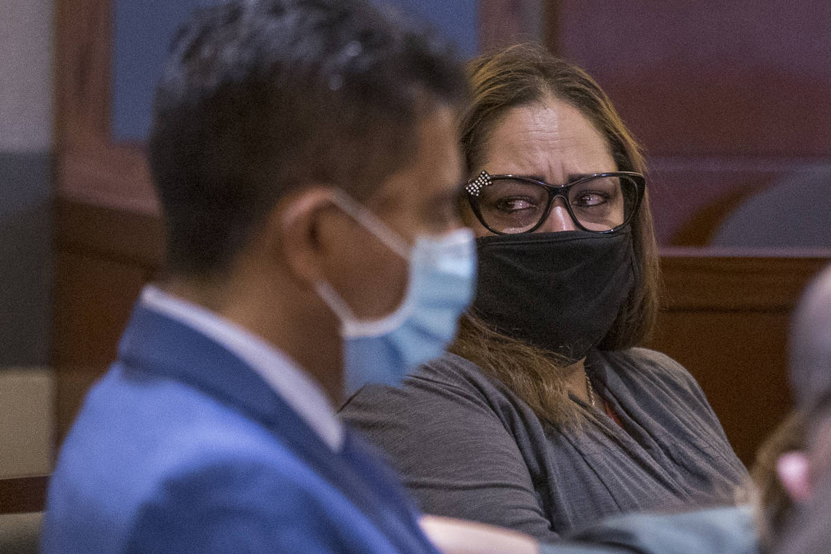 Defendant Malinda Mier, right, cries in court while viewing photos of victims during a prelimin ...