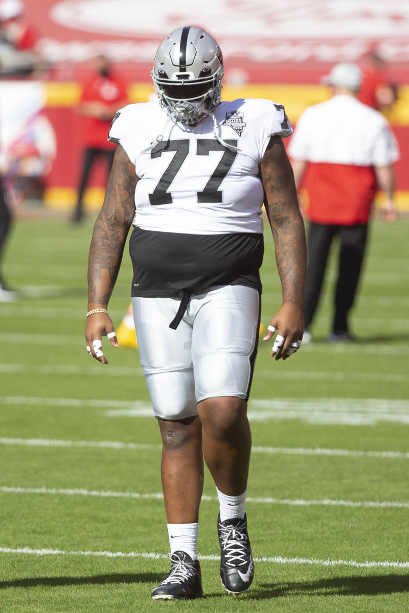 Las Vegas Raiders offensive tackle Trent Brown (77) walks on the field before an NFL football g ...