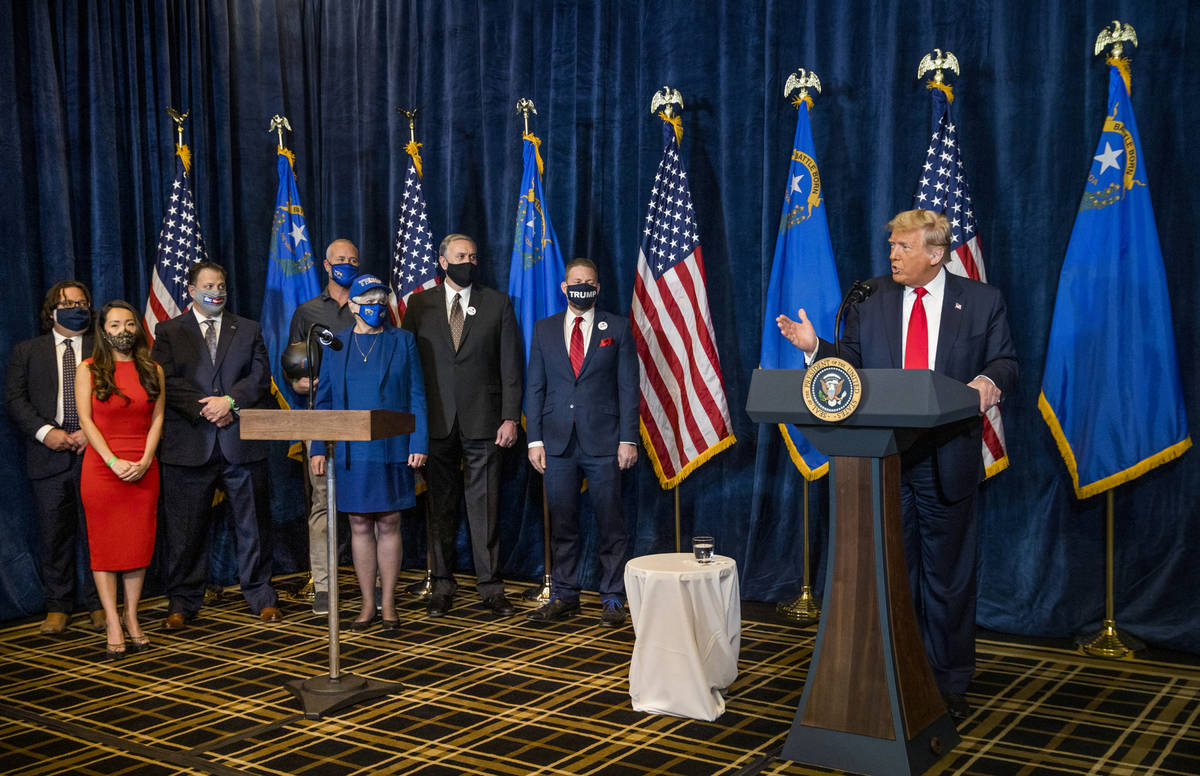 President Donald Trump answers a reporterÕs question on a recent shooting during a press c ...