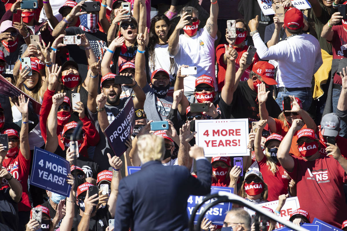 Supporters cheer as President Donald Trump speaks during Make America Great Again victory rally ...