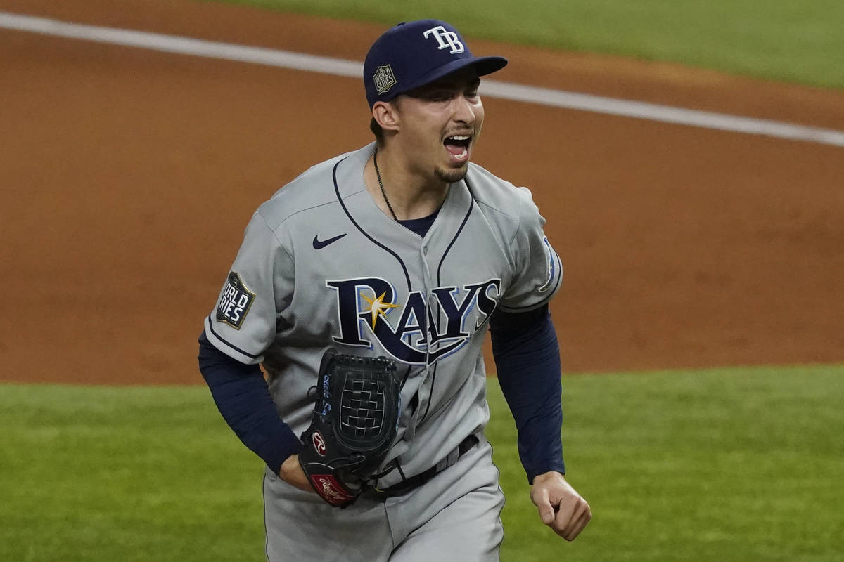 Tampa Bay Rays starting pitcher Blake Snell celebrates after striking out the side during the f ...