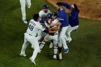Los Angeles Dodgers celebrate after defeating the Tampa Bay Rays 3-1 to win the baseball World ...