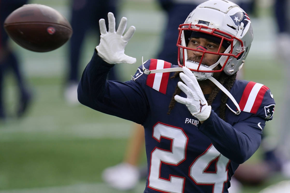 New England Patriots cornerback Stephon Gilmore warms up before an NFL football game against th ...