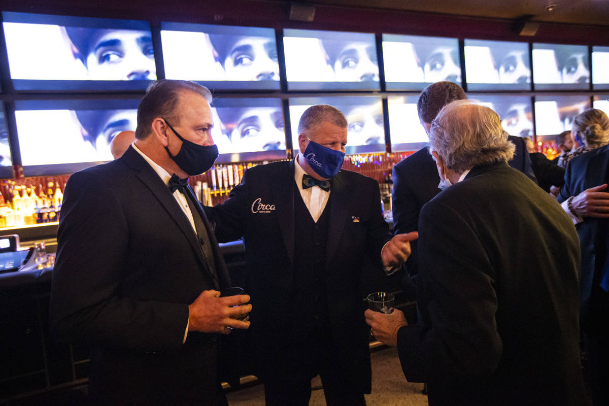 Circa owner Derek Stevens, center, mingles with friends and guests during the VIP black-tie gra ...