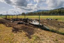 The charred remains of a skydiving plane that crash on Oahu's North Shore are shown near Waialu ...