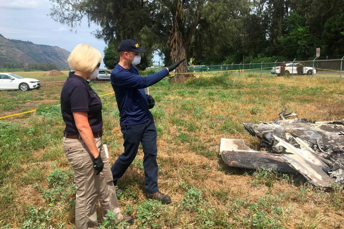 NTSB investigator Elliott Simpson, right, briefs NTSB Board Member Jennifer Homendy at the scen ...