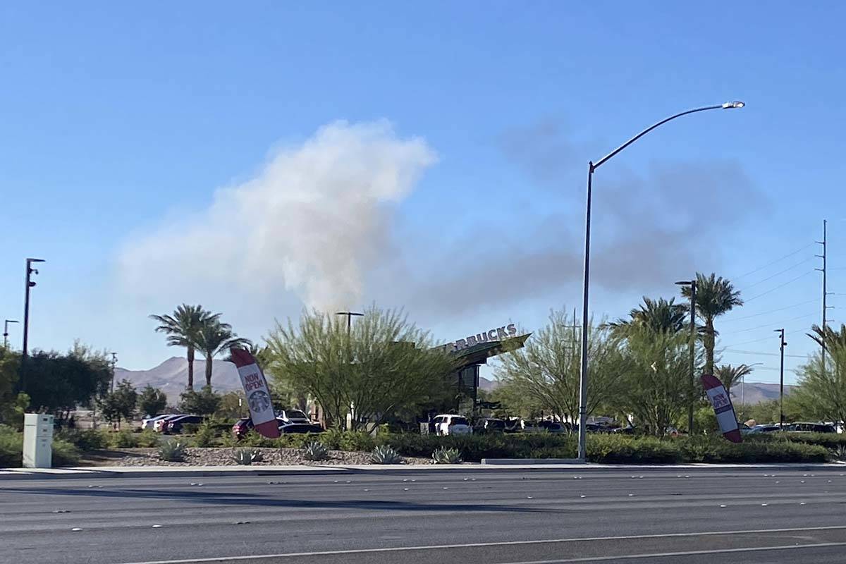 Smoke can be seen from Blue Diamond Road and Valley View Boulevard after the report of the cras ...