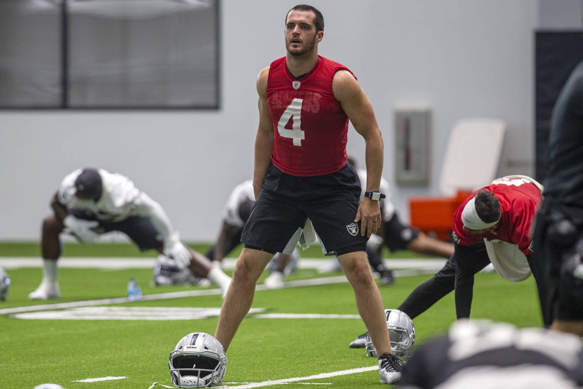 Las Vegas Raiders quarterback Derek Carr (4) stretches during a practice session at the Intermo ...