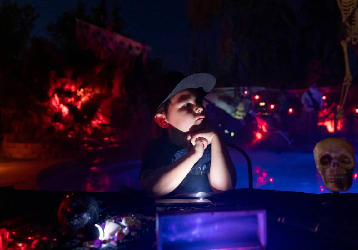 Logan Garcia, 6, sits at a table in his backyard that is decorated like The Pirates of the Car ...