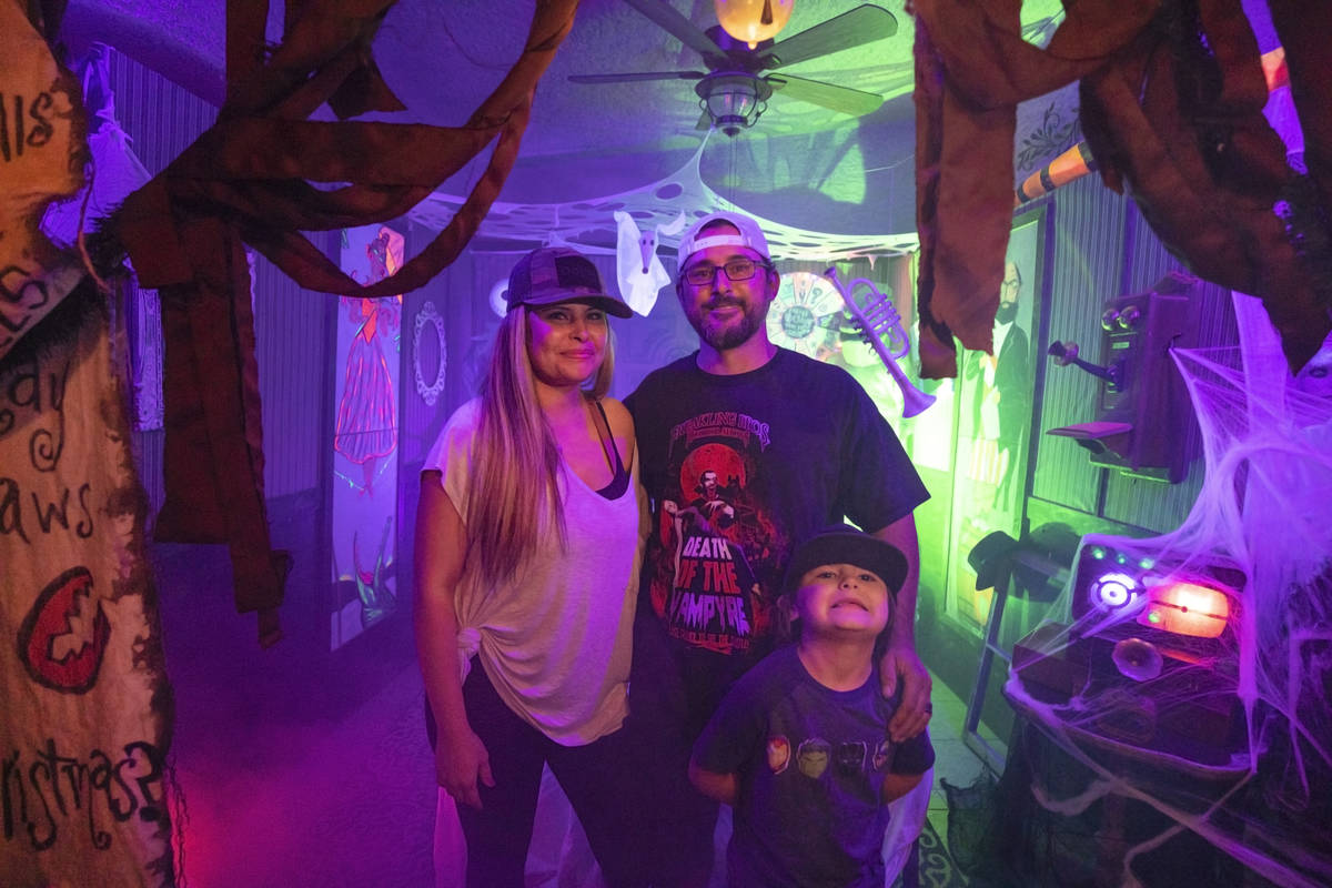 Tiffany Garcia, left, Leroy Garcia, center, and their son Logan, 6, is seen in their DIY Haunte ...