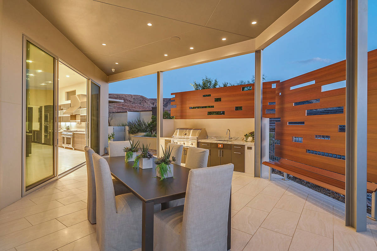 The patio has an outdoor kitchen. (Huntington and Ellis)