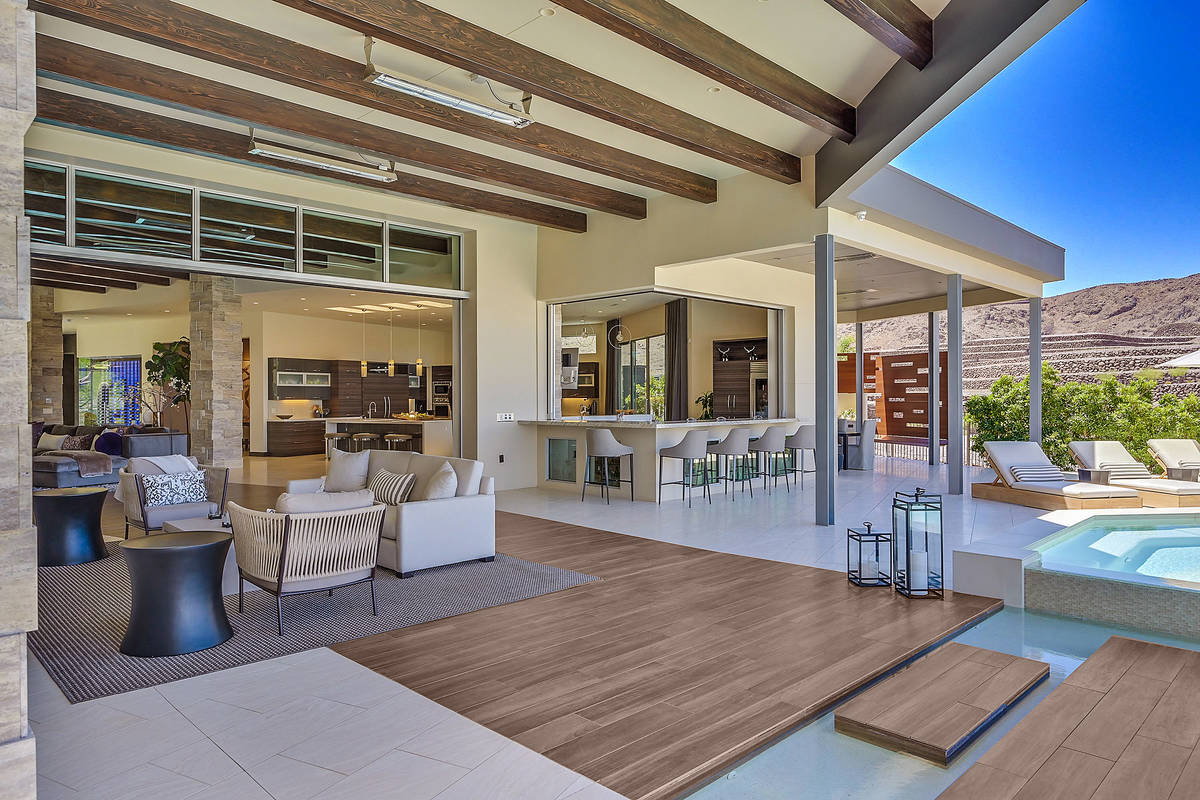 The pool extends into the patio. (Huntington and Ellis)