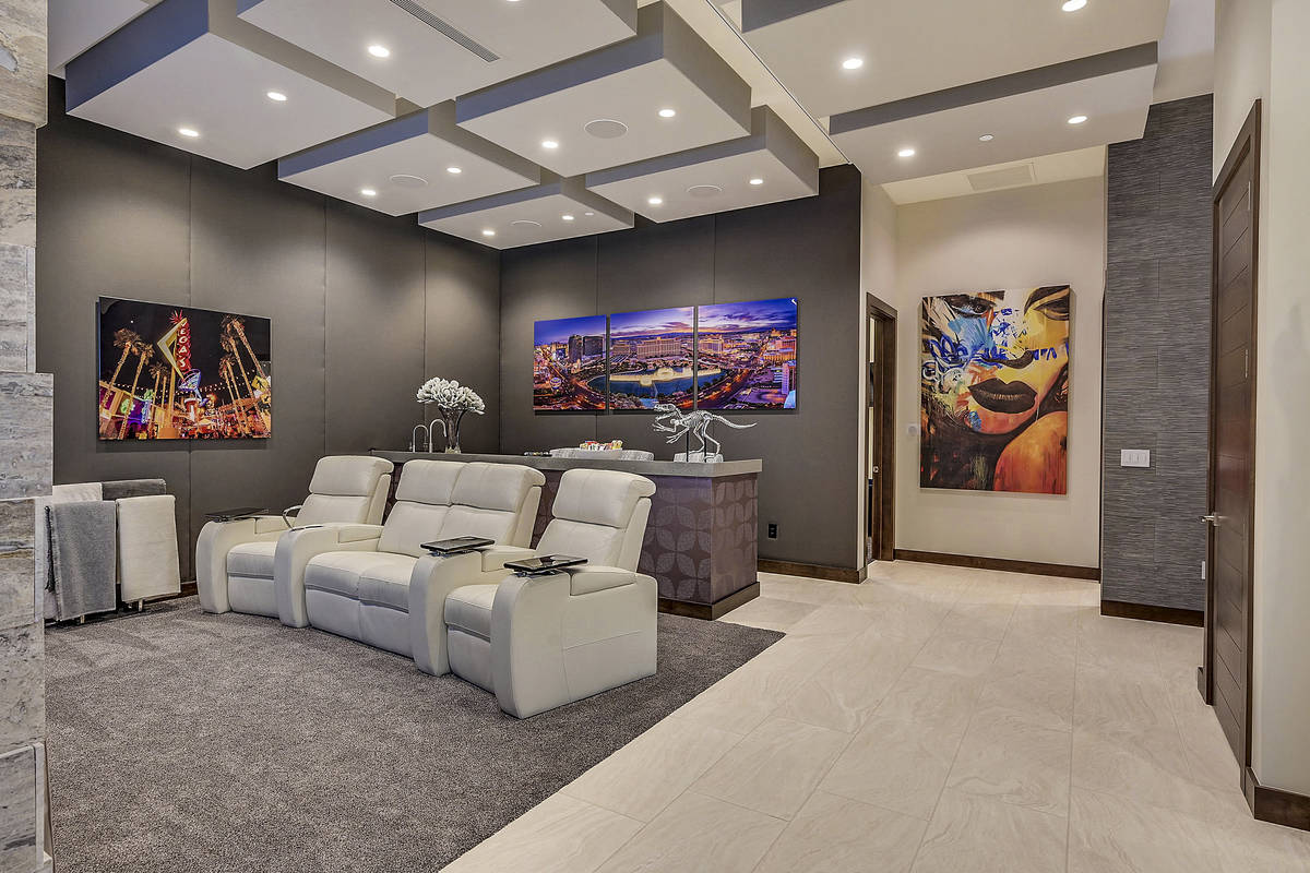 The movie theater is across from one of the custom offices. It can double as a lounge and can b ...
